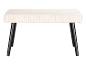 Un banc en velours blanc avec des pieds noirs.