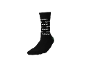 Chaussette noire mi-haute avec motif de texte blanc et talon vert
