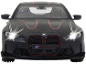 Voiture miniature noire avec phares allumés