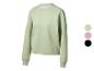Sweat-shirt femme Crivit vert clair avec col rond et échantillons de couleurs.