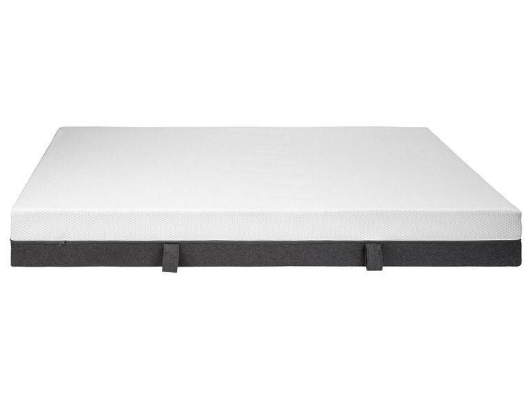 Un matelas blanc avec une housse grise