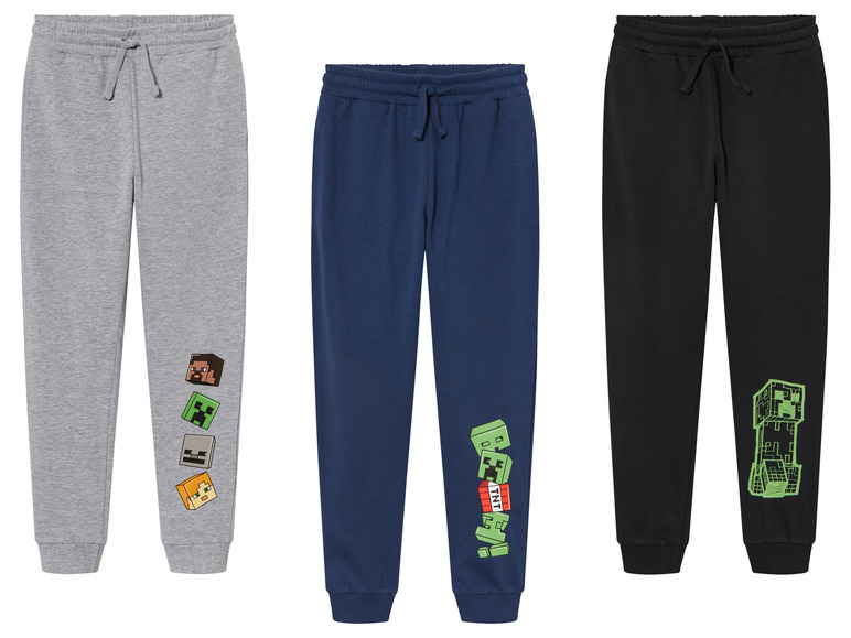 Trois pantalons de survêtement Minecraft en gris, bleu et noir.