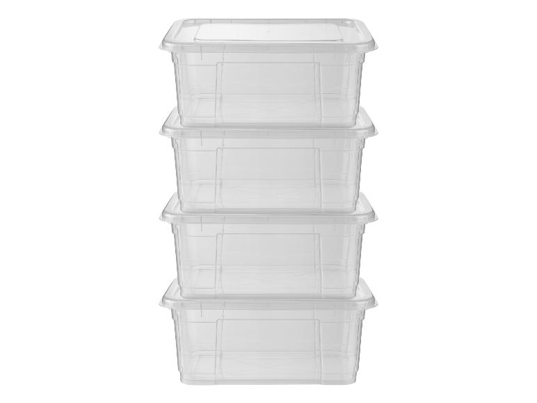 Pile de quatre boîtes de rangement en plastique transparent avec couvercles