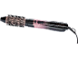 Brosse soufflante rose et noire avec tête de brosse et commandes.