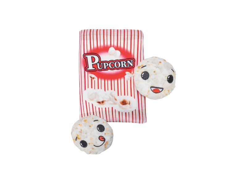 Jouet pour chien avec sac de pop-corn 'Pupcorn' et deux pop-corns aux visages souriants.
