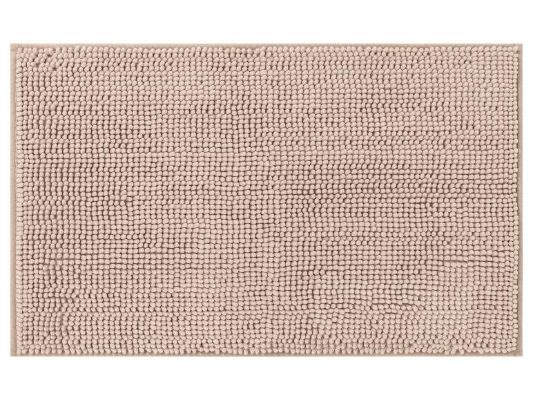 Un tapis de bain beige avec une texture douce et ronde.