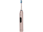 Brosse à dents électrique rose avec poils bleus et verts, avec bouton marche/arrêt.