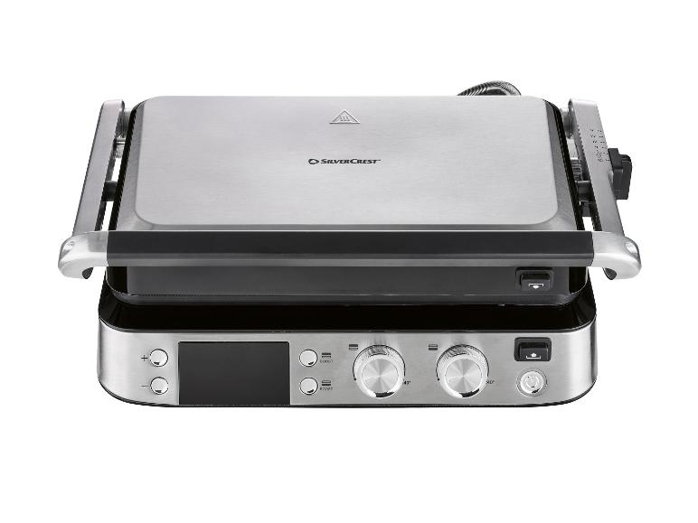 Grill électrique argenté avec écran numérique et boutons de commande.