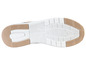 La semelle d'une basket beige avec un motif blanc.