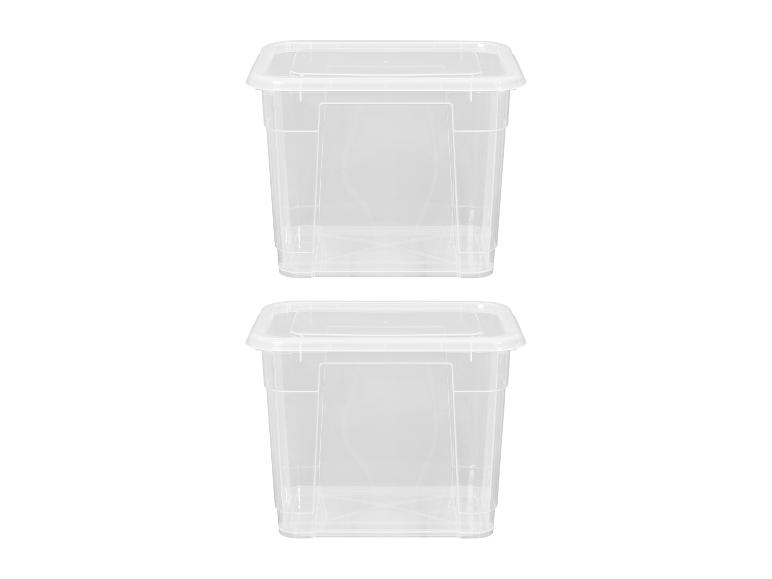 Deux boîtes de rangement en plastique transparent avec couvercles, empilées verticalement sur fond blanc.