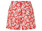 Short rouge avec un motif abstrait blanc.