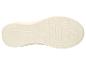 Semelle de chaussure de sport crème avec motif de traction géométrique.