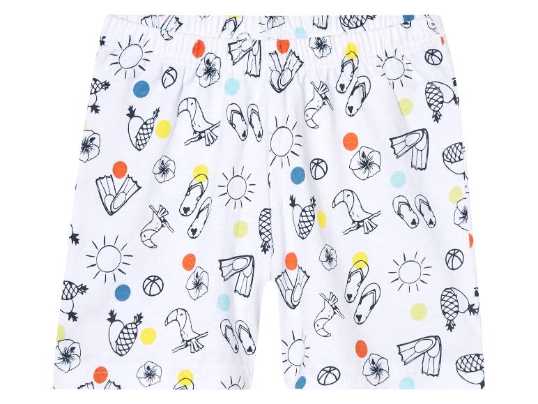 Shorts enfant à motif été : toucans, ananas, palmes et tongs.