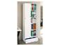 Une armoire blanche avec des classeurs colorés et des livres de design, avec un tiroir ouvert.