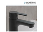Un robinet de lavabo noir de la marque Schütte.