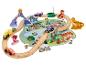 Circuit de train en bois sur le thème des dinosaures avec des véhicules et des personnages de dessins animés.