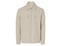 Chemise beige à manches longues avec fermeture éclair.
