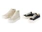 Des baskets en toile beige et noires avec des semelles épaisses blanches.