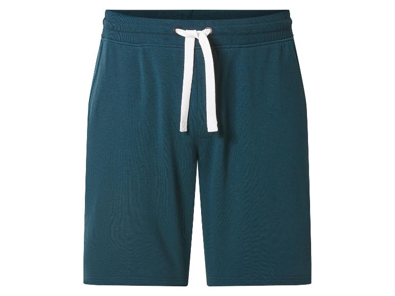 Short de survêtement bleu foncé avec cordon de serrage blanc.
