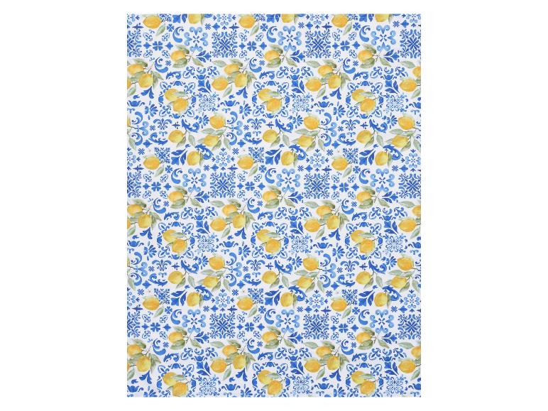 Set de table et serviettes avec motif citron et azulejos bleus.