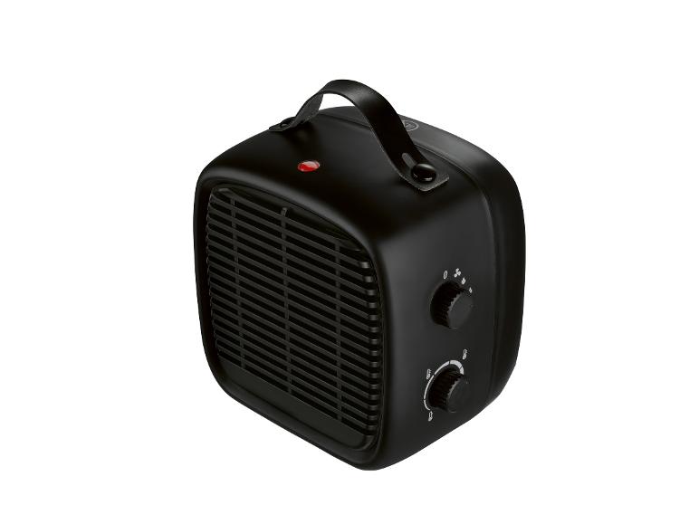 Radiateur électrique portable noir avec poignée et commandes.