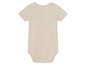 Un body bébé beige à manches courtes.