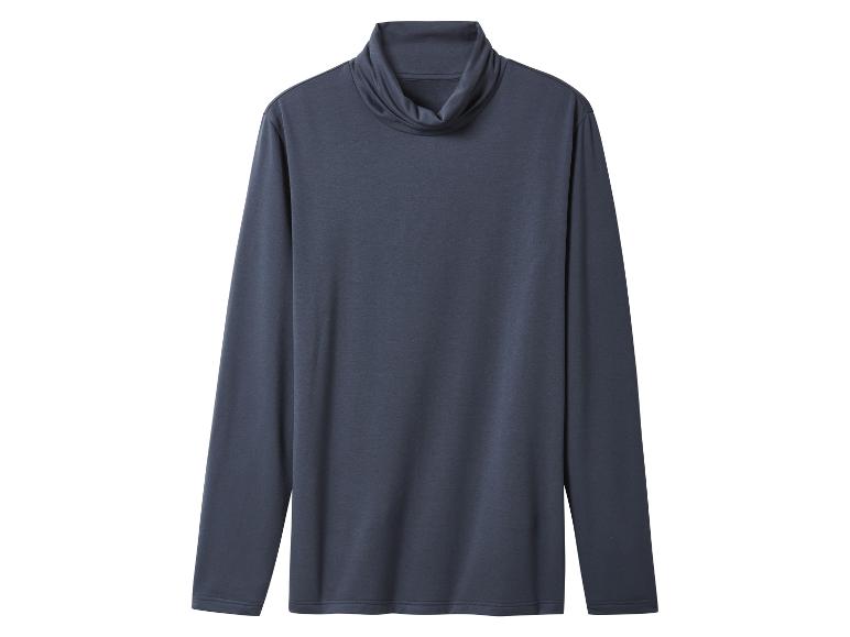 Un pull col roulé gris foncé à manches longues, posé à plat.