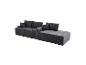 Canapé modulaire gris foncé avec coussins, au design côtelé.