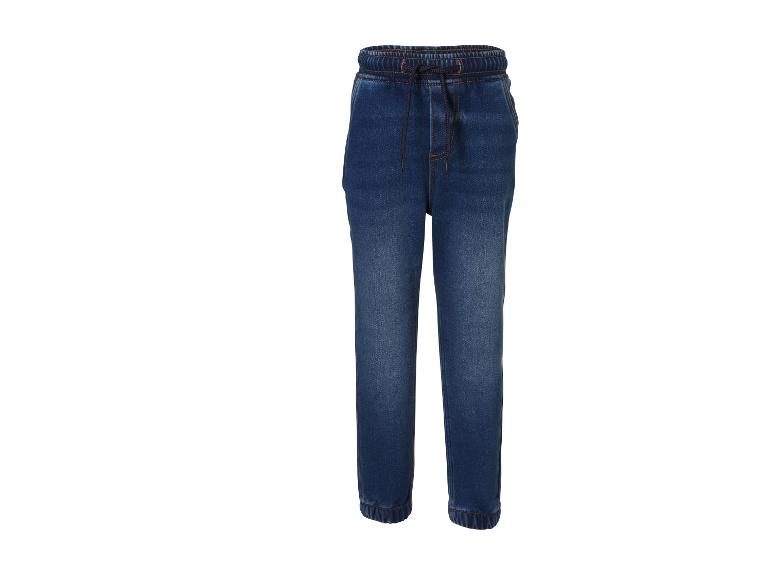 Jogger en jean bleu avec cordon de serrage à la taille et chevilles élastiques.