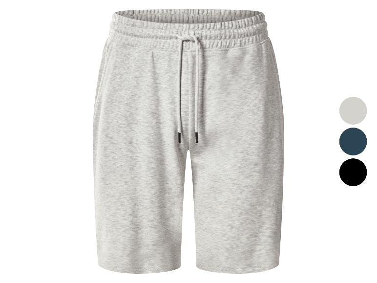 Shorts de survêtement gris chiné avec cordon de serrage et échantillons de couleurs gris, bleu foncé et noir.