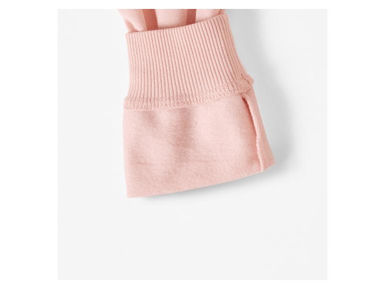 Détail d'un pull rose en tricot
