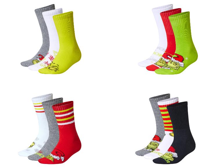 Chaussettes Grinch pour enfants de différentes couleurs et motifs.