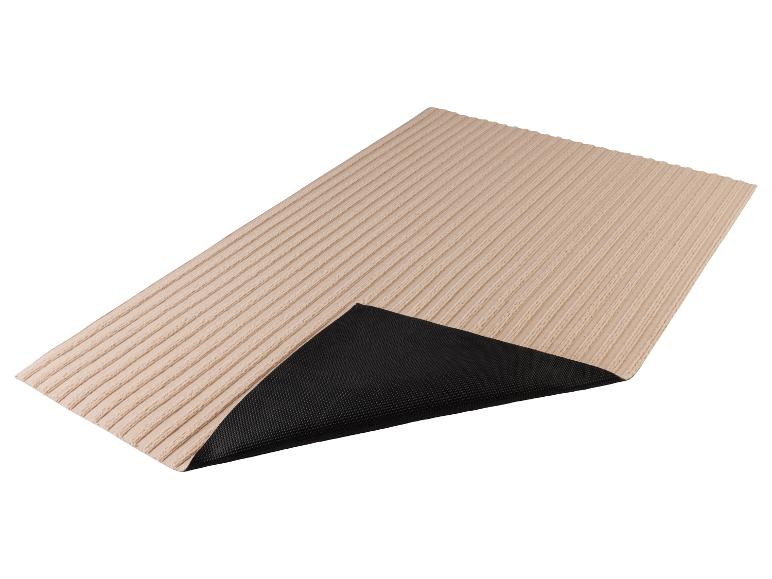 Paillasson beige avec une base en caoutchouc