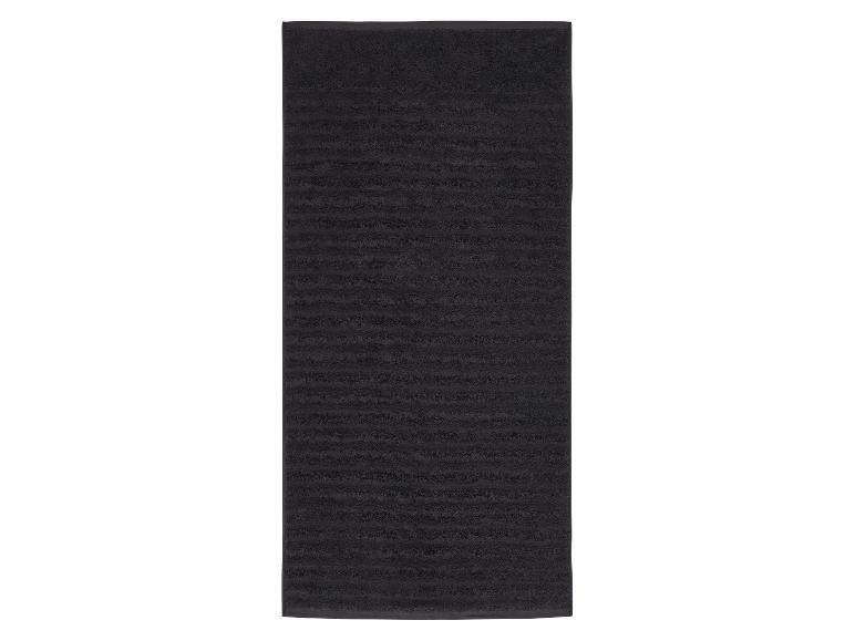 Tapis de bain rectangulaire noir avec texture côtelée horizontale