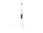 Brosse à dents électrique blanche avec une tête bleue et verte sur une base de chargement.