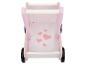 Poussette de poupée en bois rose avec cœurs et roues noires.