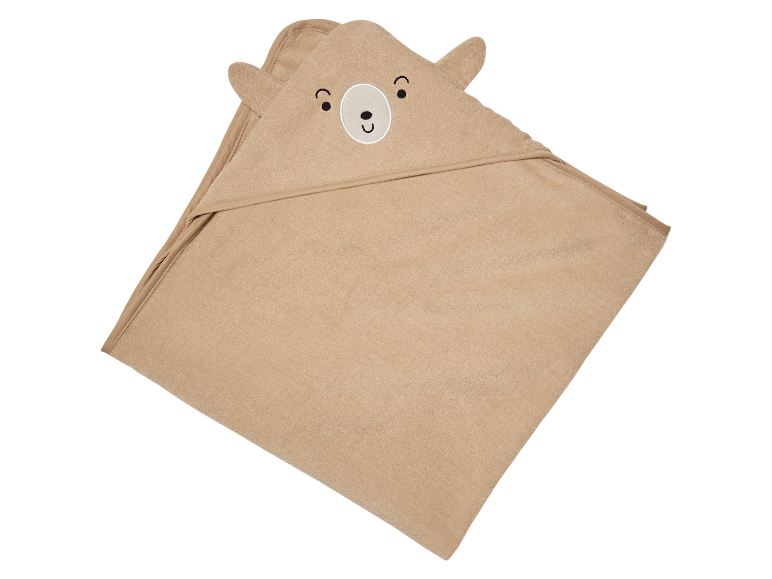 Une serviette de bain beige à capuche en forme d'ours.