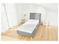 Un cadre de lit gris avec un matelas blanc sur un sol en bois.