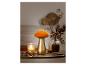Lampe dorée en forme de champignon avec un abat-jour orange.