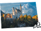 Puzzle représentant le château de Neuschwanstein en automne avec des montagnes en arrière-plan.