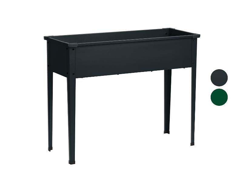 Une jardinière noire avec des pieds pour le balcon ou le jardin.