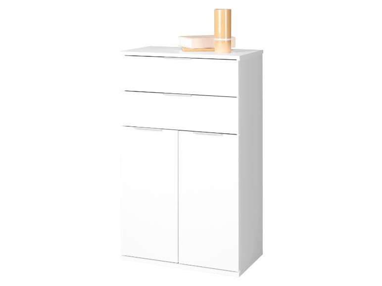 Meuble blanc avec deux tiroirs et deux portes, décoré de livres et d'un vase.