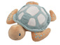 Une peluche de tortue bleue et beige.