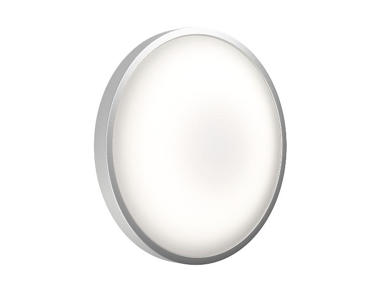 Plafonnier LED rond avec bord argenté, émettant une douce lumière blanche.