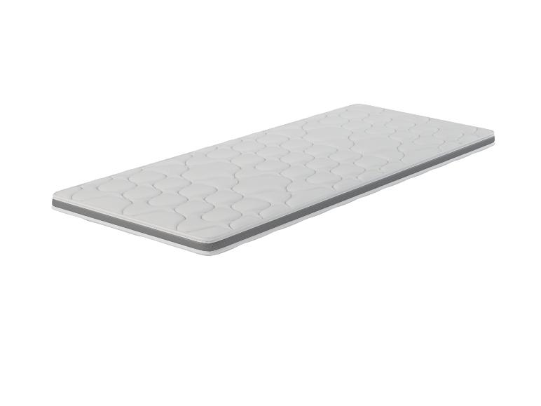 Un matelas blanc avec une bordure grise.