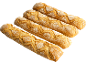 Quatre baguettes dorées et farinées disposées en diagonale sur fond noir.