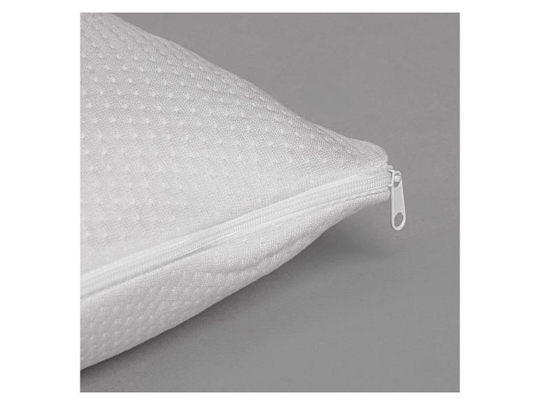 Oreiller blanc avec fermeture éclair et surface texturée