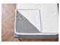 Un matelas gris avec un surmatelas blanc et une housse grise