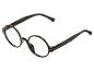Lunettes rondes noires au design classique.