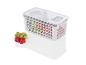 Une boîte de rangement en plastique blanc avec couvercle, remplie de fruits et légumes.